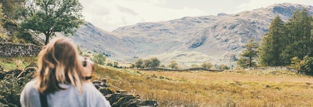 Woman photographing a landscape